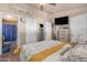 Main bedroom with dresser and a view into the bathroom at 6835 W Taylor St # 208, Phoenix, AZ 85043