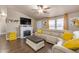 Spacious living room with a cozy fireplace and large sectional sofa at 6835 W Taylor St # 208, Phoenix, AZ 85043