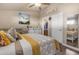 Main bedroom with queen bed and en-suite bathroom access at 6835 W Taylor St # 208, Phoenix, AZ 85043