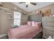 Bedroom with full bed, dresser and shelving at 6835 W Taylor St # 208, Phoenix, AZ 85043