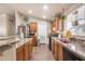 Spacious kitchen with wood cabinets and granite countertops at 6835 W Taylor St # 208, Phoenix, AZ 85043