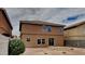 Two-story house with neutral exterior and desert landscaping at 45612 W Tucker Rd, Maricopa, AZ 85139