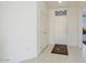 Bright entryway with tile flooring and a coat closet at 16121 W Silver Falls Dr, Surprise, AZ 85374
