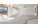 Open living room with sliding doors leading to the patio at 16121 W Silver Falls Dr, Surprise, AZ 85374