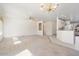 Spacious living room with views into the kitchen area at 16121 W Silver Falls Dr, Surprise, AZ 85374