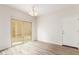 Dining area with hardwood floors and sliding glass doors to the patio at 915 E Agua Fria Ln, Avondale, AZ 85323