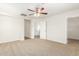 Bedroom with ceiling fan and access to hallway and loft at 915 E Agua Fria Ln, Avondale, AZ 85323