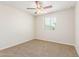 Bright bedroom with ceiling fan and window coverings at 915 E Agua Fria Ln, Avondale, AZ 85323