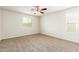 Bright bedroom featuring neutral walls and carpet at 915 E Agua Fria Ln, Avondale, AZ 85323