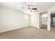 Spacious bedroom with ceiling fan and access to bathroom at 915 E Agua Fria Ln, Avondale, AZ 85323