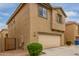 Two-story home with attached garage and landscaping at 915 E Agua Fria Ln, Avondale, AZ 85323