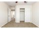 Spacious bedroom with ceiling fan and access to hallway at 915 E Agua Fria Ln, Avondale, AZ 85323