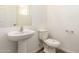Clean bathroom with pedestal sink, toilet and shower at 915 E Agua Fria Ln, Avondale, AZ 85323