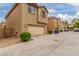 Two-story home with attached garage and driveway at 915 E Agua Fria Ln, Avondale, AZ 85323