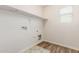 Convenient laundry room with shelving and space for a washer and dryer at 915 E Agua Fria Ln, Avondale, AZ 85323