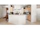 Well-equipped kitchen with light wood cabinets and granite countertops at 16121 W Silver Falls Dr, Surprise, AZ 85374