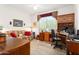 Home office with built-in wooden desk and seating area at 16121 W Silver Falls Dr, Surprise, AZ 85374