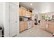 Bright kitchen with light wood cabinets and a breakfast nook at 16121 W Silver Falls Dr, Surprise, AZ 85374