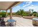 Spacious patio with seating area and view of the desert landscape at 16121 W Silver Falls Dr, Surprise, AZ 85374