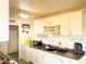 Bright kitchen with white cabinets and tiled backsplash at 6767 N 7Th St # 217, Phoenix, AZ 85014
