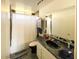 Bathroom with tub, shower, and dark vanity at 6767 N 7Th St # 217, Phoenix, AZ 85014