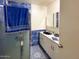 Clean bathroom with blue tile, shower, and vanity at 6767 N 7Th St # 217, Phoenix, AZ 85014