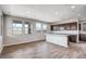 Modern kitchen with island, dark cabinetry, and granite countertops at 1308 W Macaw Ct, Queen Creek, AZ 85142