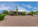 Landscaped backyard with desert plants at 25024 S Stoney Lake Dr, Sun Lakes, AZ 85248