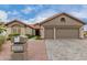 Two-car garage and stone facade at 25024 S Stoney Lake Dr, Sun Lakes, AZ 85248