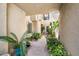 Private courtyard with lush tropical plants and walkway at 8300 E Vía De Ventura Blvd # 1015, Scottsdale, AZ 85258