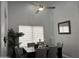 Bright dining room featuring a ceiling fan and large window at 9167 N 73Rd Ln, Peoria, AZ 85345