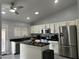 Modern kitchen with stainless steel appliances and island at 9167 N 73Rd Ln, Peoria, AZ 85345