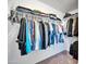 Well-organized closet with hanging clothes and shelves at 12313 W Essig Way, Peoria, AZ 85383