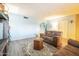 Living room with a view of the entryway and a comfortable seating arrangement at 9626 N 35Th Ln, Phoenix, AZ 85051