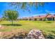 Back view of Greenfield Glen community with grassy lawn at 1021 S Greenfield Rd # 1080, Mesa, AZ 85206