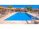 Community pool with lounge chairs and patio area at 1021 S Greenfield Rd # 1080, Mesa, AZ 85206