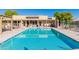 Inviting community pool with ample lounge chairs and seating at 1021 S Greenfield Rd # 1080, Mesa, AZ 85206