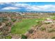 Luxury homes and a golf course are shown in this scenic aerial view at 10039 N Mcdowell View Trl, Fountain Hills, AZ 85268
