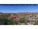 Aerial view showcasing a residential area with mountain backdrop, featuring various architectural styles at 10039 N Mcdowell View Trl, Fountain Hills, AZ 85268
