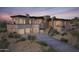 Modern home with stone accents and a three-car garage at 10039 N Mcdowell View Trl, Fountain Hills, AZ 85268