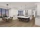 Modern kitchen with island, white cabinets, and wood floors at 10039 N Mcdowell View Trl, Fountain Hills, AZ 85268