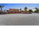 Long gravel driveway leading to a large estate at 21234 W Caravaggio Ln, Wittmann, AZ 85361