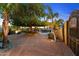 Charming backyard patio with fireplace and seating area at 21234 W Caravaggio Ln, Wittmann, AZ 85361