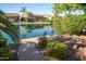 Peaceful lakefront view with seating area at 42531 W Heavenly Pl, Maricopa, AZ 85138
