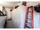 Garage with ample storage and workbench at 42531 W Heavenly Pl, Maricopa, AZ 85138