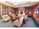 Community library with comfortable seating and a fireplace at 42531 W Heavenly Pl, Maricopa, AZ 85138