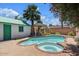 Relaxing pool and spa area with pergola and lush landscaping at 73 W Lewis Ave, Phoenix, AZ 85003