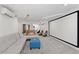 Finished basement with a large screen and seating area at 73 W Lewis Ave, Phoenix, AZ 85003