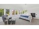 Bright bedroom with a bed and sitting area at 73 W Lewis Ave, Phoenix, AZ 85003