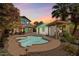 Inviting kidney shaped pool and spa with pergola in backyard at 73 W Lewis Ave, Phoenix, AZ 85003